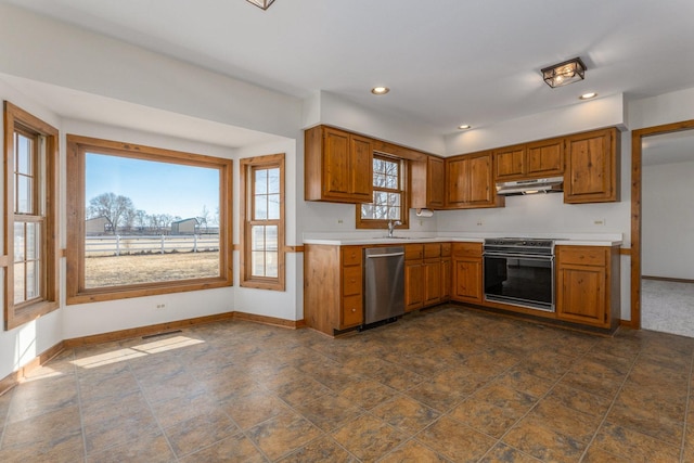 kitchen featuring dishwasher, under cabinet range hood, brown cabinetry, and electric range oven