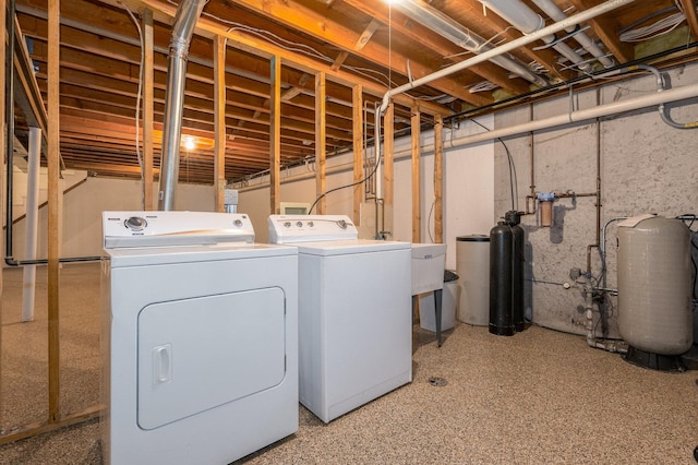 laundry room with laundry area and washer and clothes dryer