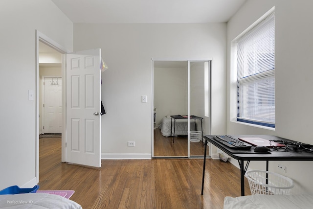 office space with wood-type flooring