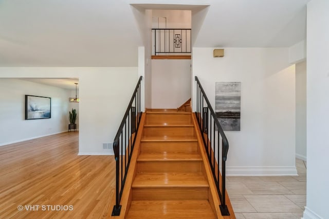 staircase featuring hardwood / wood-style flooring