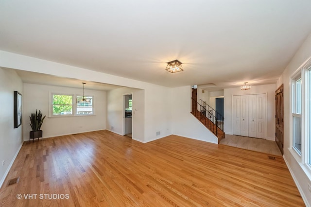 unfurnished living room featuring light hardwood / wood-style flooring