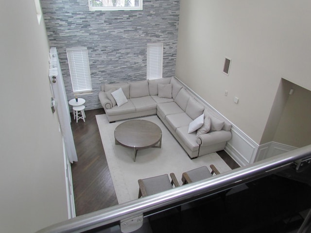 living room with dark hardwood / wood-style flooring