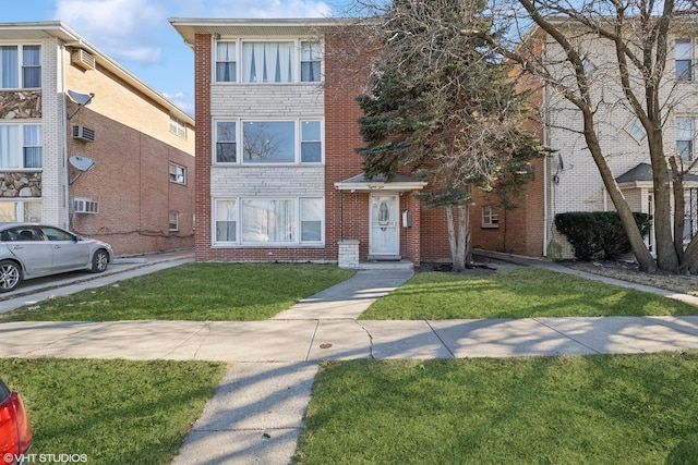 view of property featuring a front lawn