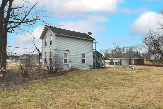 back of property with a lawn