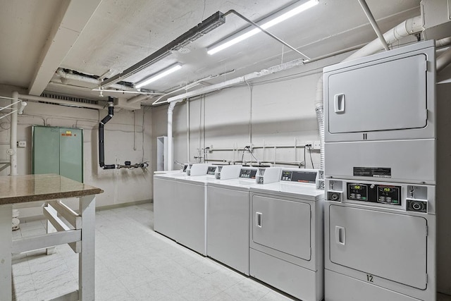 laundry area featuring stacked washer / drying machine and independent washer and dryer