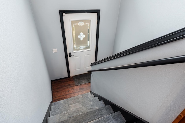 stairway featuring hardwood / wood-style flooring