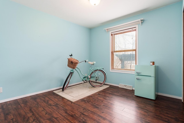 interior space with dark hardwood / wood-style floors