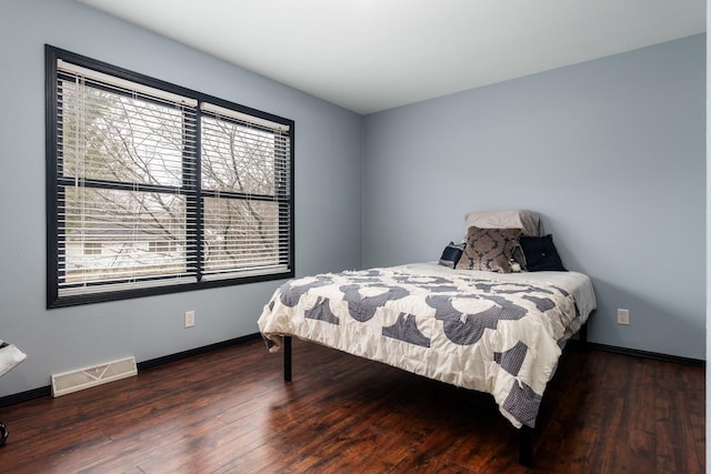 bedroom featuring dark hardwood / wood-style floors