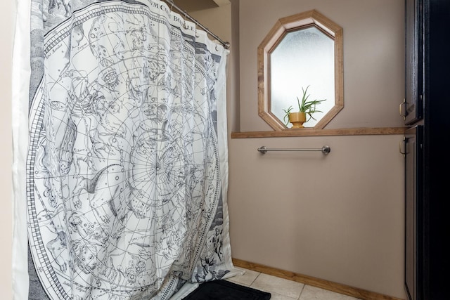 bathroom with tile patterned floors and walk in shower