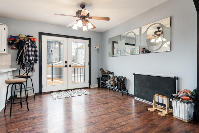 entryway with ceiling fan, dark hardwood / wood-style flooring, and french doors