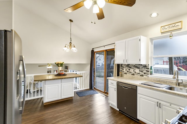 kitchen with white cabinetry, dishwasher, sink, hanging light fixtures, and stainless steel refrigerator with ice dispenser