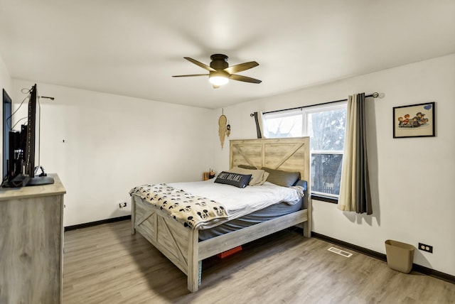 bedroom featuring ceiling fan and light wood-type flooring