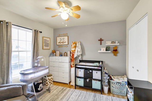 bedroom featuring ceiling fan and light wood-type flooring