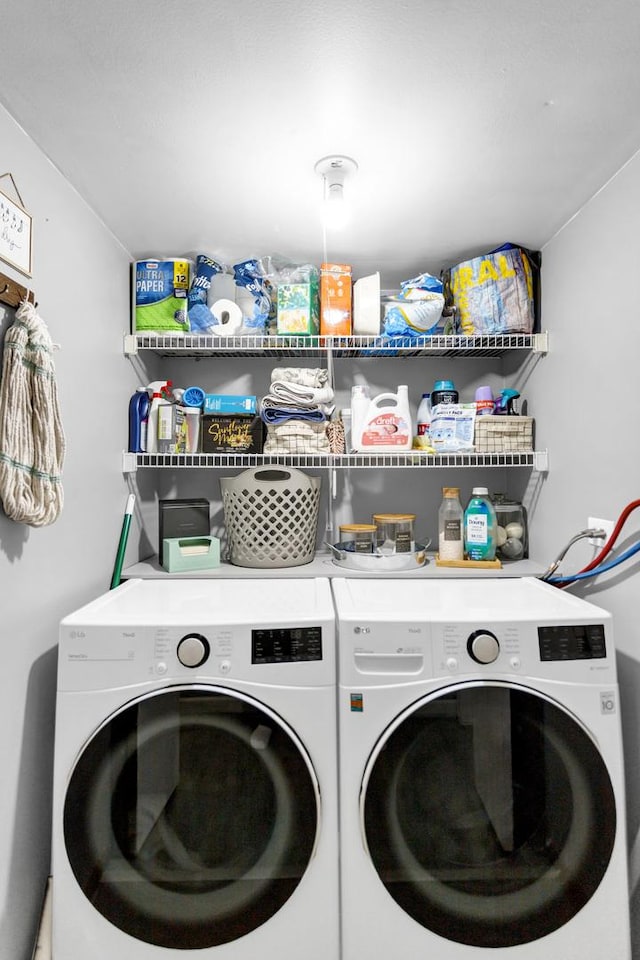 washroom with separate washer and dryer