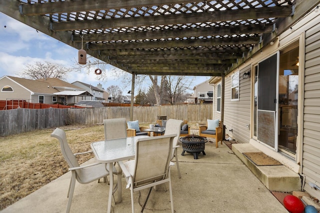 view of patio / terrace with a pergola and a fire pit