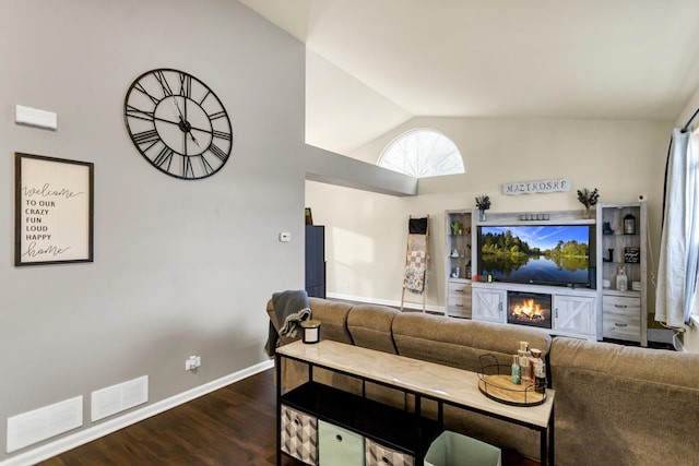 living room with lofted ceiling and dark hardwood / wood-style flooring