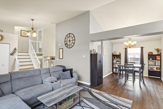 living room with an inviting chandelier, dark hardwood / wood-style floors, and high vaulted ceiling