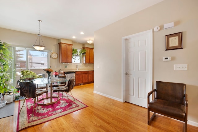 5405 W Galewood Ave, Chicago, IL 60639 - dining space featuring sink and light wood-type flooring
