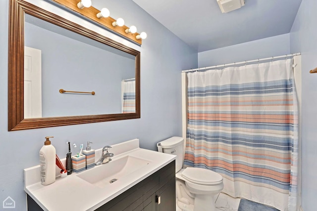 bathroom with vanity, toilet, and a shower with shower curtain