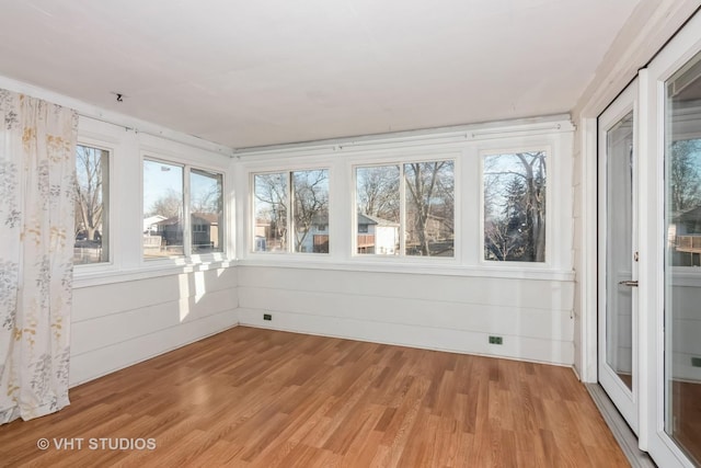 unfurnished sunroom with a healthy amount of sunlight