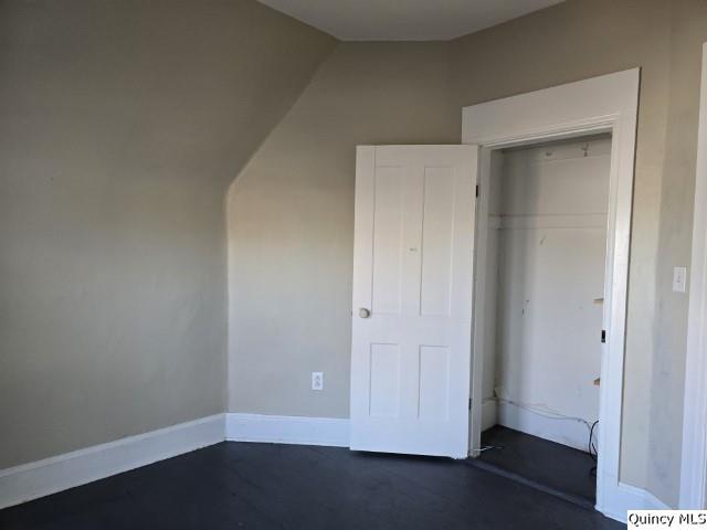 unfurnished bedroom featuring a closet