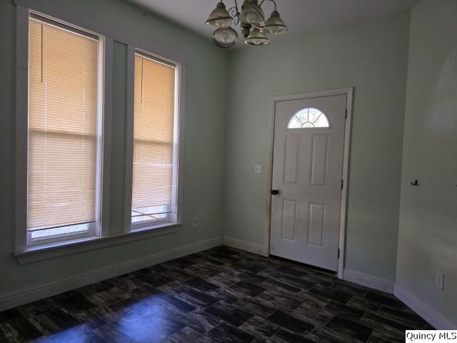 entrance foyer with a notable chandelier