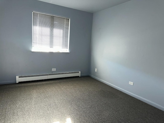 spare room featuring baseboards and baseboard heating