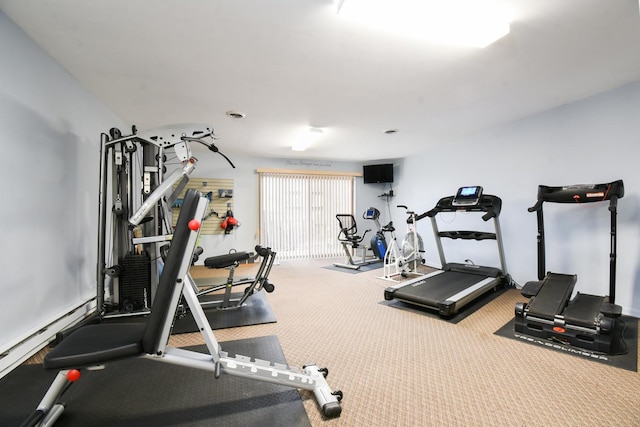 workout area with a baseboard radiator