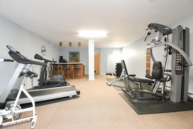 exercise area featuring carpet flooring