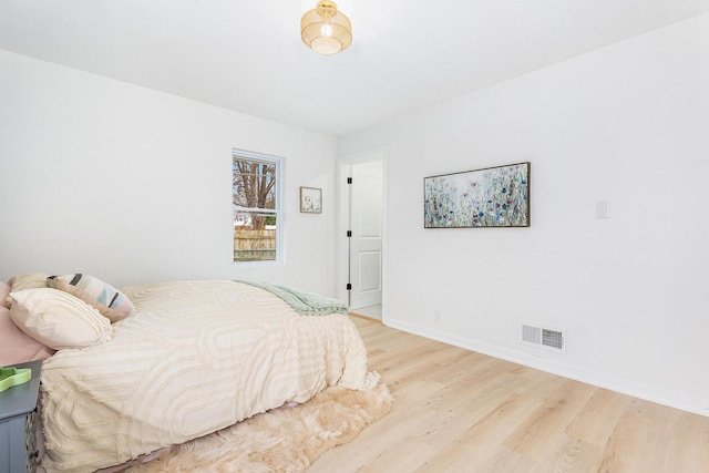 bedroom with light hardwood / wood-style flooring