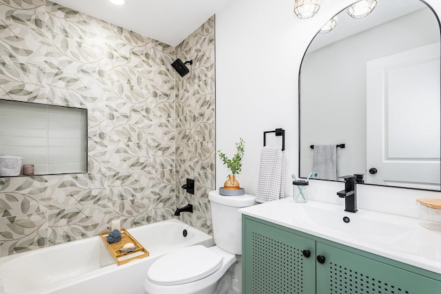 full bathroom with tiled shower / bath, vanity, and toilet