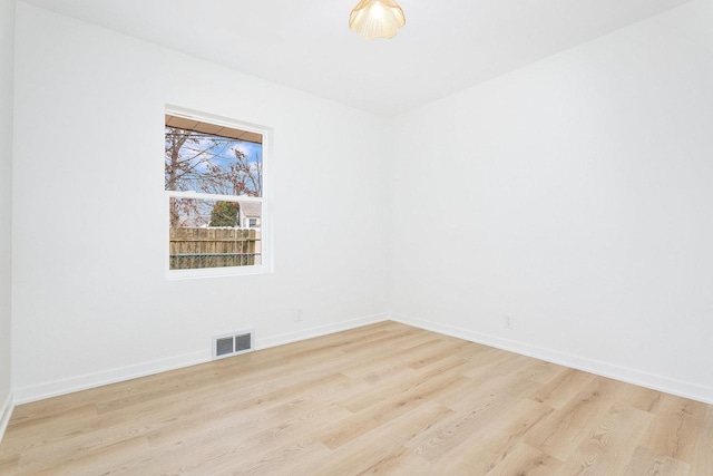 spare room with light hardwood / wood-style floors