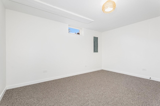 carpeted empty room featuring electric panel