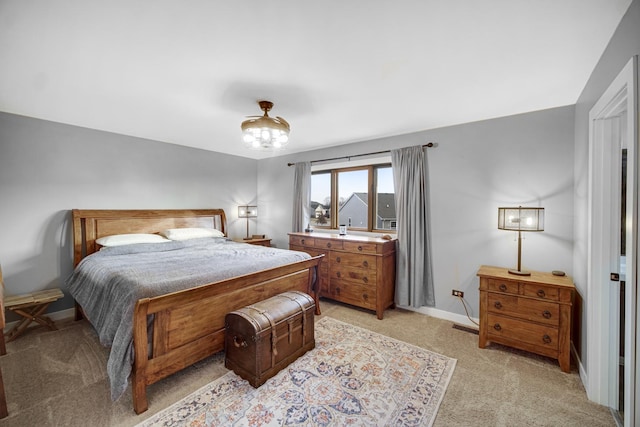 bedroom featuring light carpet