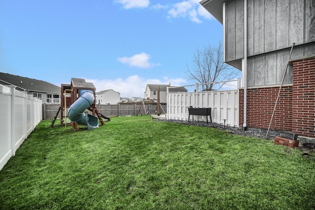 view of yard with a playground