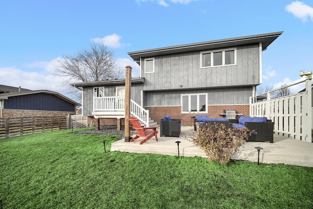 back of property featuring an outdoor living space, a yard, a patio, and central AC unit