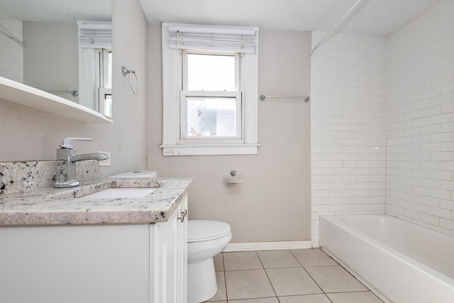 full bathroom featuring tile patterned flooring, vanity, tiled shower / bath, and toilet