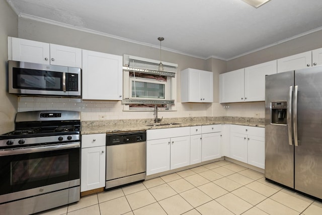 kitchen with stainless steel appliances, white cabinetry, sink, and light stone counters