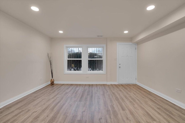 empty room with light wood-type flooring