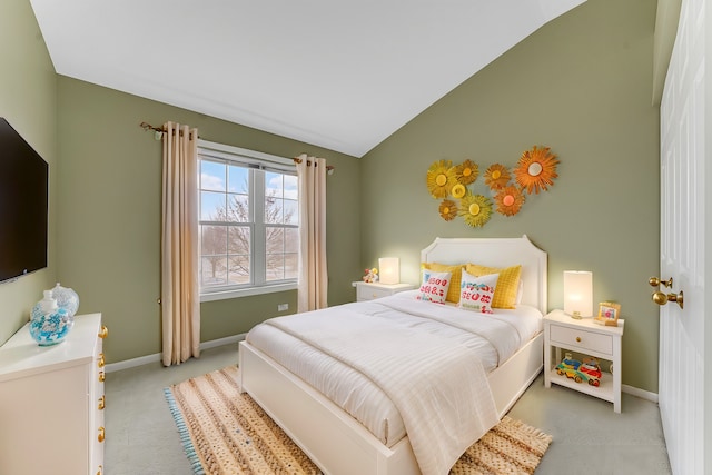 carpeted bedroom featuring vaulted ceiling