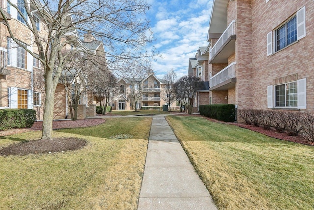 view of community featuring a lawn