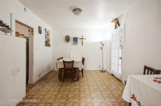 dining room with light parquet floors