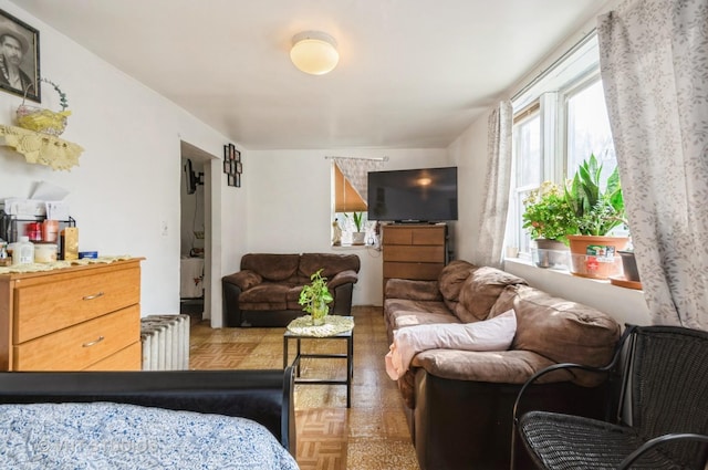 bedroom with radiator and parquet floors