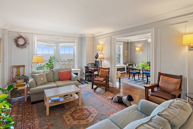 living room featuring crown molding and wood-type flooring