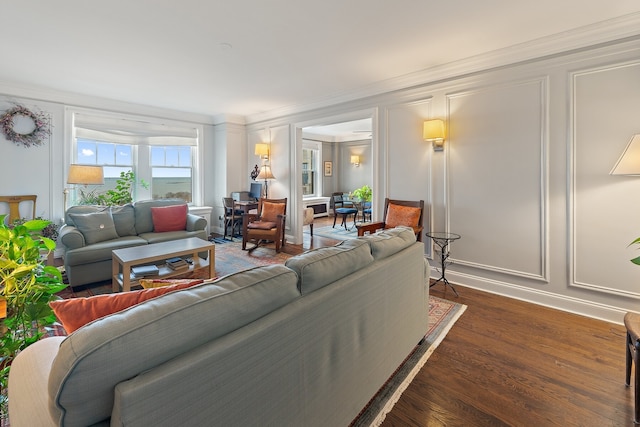 living room with ornamental molding and dark hardwood / wood-style floors