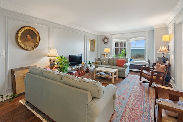 living room with crown molding and dark wood-type flooring