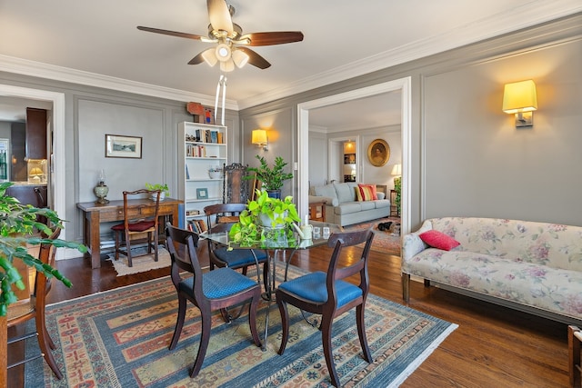 dining space with ornamental molding, dark hardwood / wood-style floors, and ceiling fan