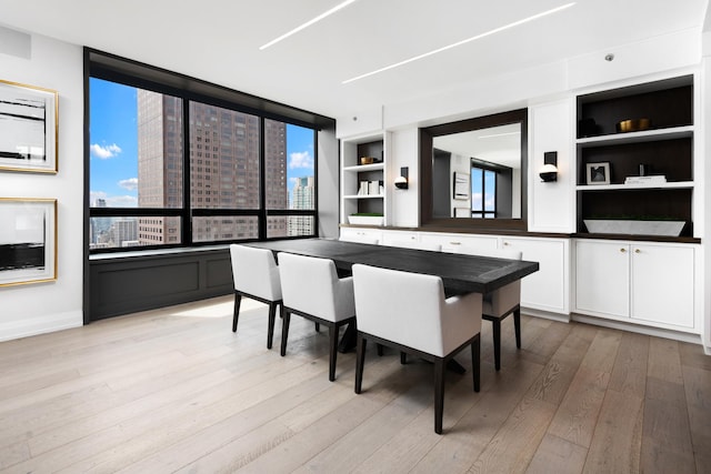 dining area featuring light wood-type flooring