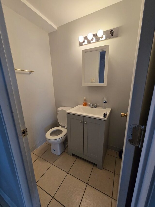 611 Andover St, Chicago Heights, IL 60411 - bathroom with vanity, tile patterned floors, and toilet