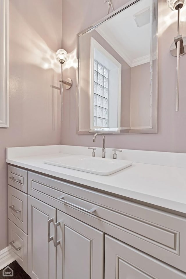 bathroom with vanity and crown molding